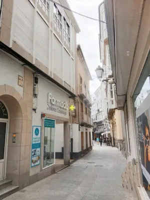 an empty street in a city with buildings at Pastor Diaz Home in Viveiro