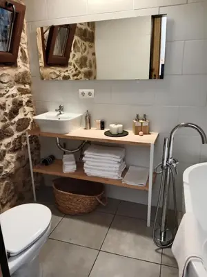 a bathroom with a sink and a toilet at La Gavina in Beáriz