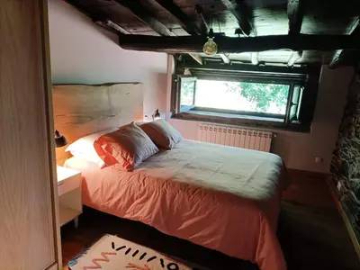 a wooden door in a room with a table at Casa Yañez in Chantada