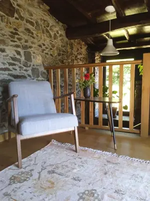 a bedroom with a bed and three pictures on the wall at Casa Yañez in Chantada