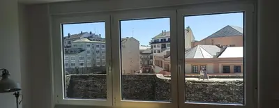 a view of a city from a window at Adarve, con parking y vistas a la muralla in Lugo