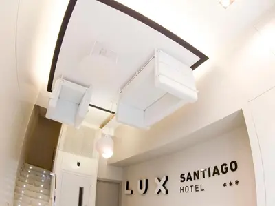 a pair of lights hanging from the ceiling in a room at Hotel Lux Santiago in Santiago de Compostela