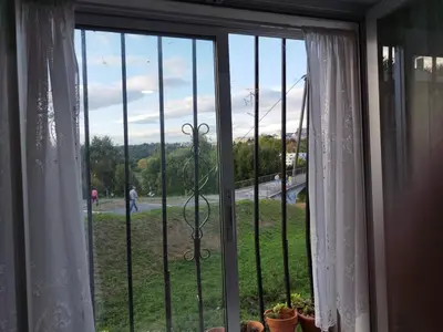 a window with a view of a field of grass at Lazzaretto vivienda uso turístico in Lugo