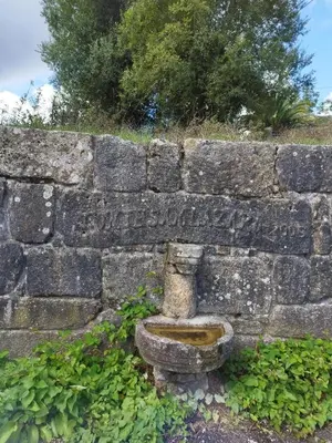 a stone wall with a sign on it at Lazzaretto vivienda uso turístico in Lugo