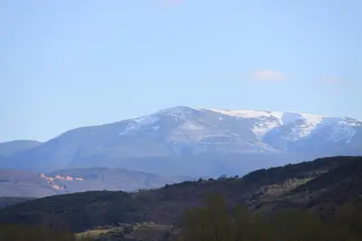 a snow covered mountain in the distance at Venecia Bed&Breakfast in Villafranca del Bierzo