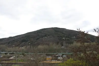 a mountain in the distance with a train at Venecia Bed&Breakfast in Villafranca del Bierzo