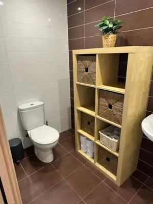 a bathroom with a toilet and a sink at Arnela Reinante in Barreiros