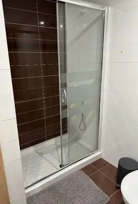 a shower with a glass door in a bathroom at Arnela Reinante in Barreiros