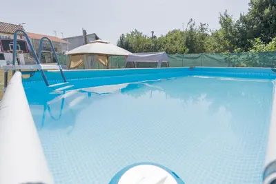 a swimming pool on the roof of a house at Casa Luna Rural Con Piscina y Jardín in Ourense