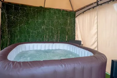 a bedroom with a large bed and a window at Casa Luna Rural Con Piscina y Jardín in Ourense