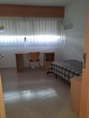 a room with a desk and a chair and a bed at Micampus Lugo Student Residence in Lugo