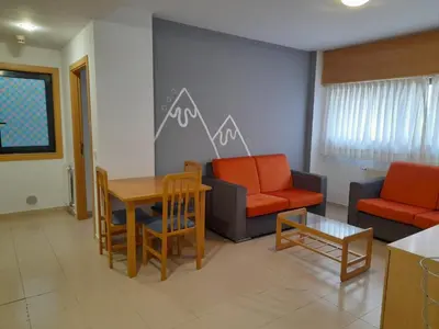 a living room with couches and a table and chairs at Micampus Lugo Student Residence in Lugo