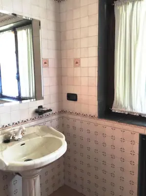 a bathroom with a sink and a mirror at Casa Vilanova in A Coruña