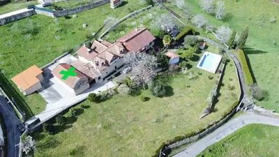 an overhead view of a house with a green cross on it at Casa Rústica O Abeiro in Pontevedra