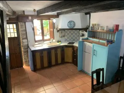 a kitchen with a sink and a counter top at Casa do Duende in Tedejo