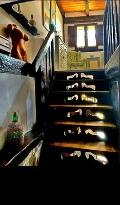 a group of shoes on the stairs of a building at Casa do Duende in Tedejo