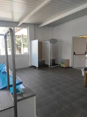 a large room with a tile floor and a large window at Casa da Pinguela Camino Inglés in Ordes