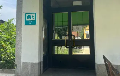 a black door with a sign in front of it at Hostel Azul Cielo in O Pedrouzo