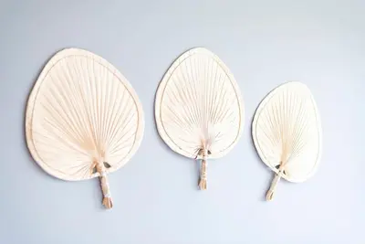 a pair of hoop earrings with gold feathers at Apartamento Las Candelas, Ares in Ares