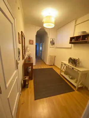 a hallway with a room with a rug and a table at PISO EN ESTACION DE MONFORTE DE LEMOS in Monforte de Lemos