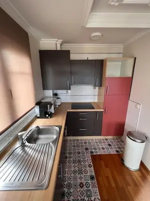 a kitchen with a sink and a counter top at Apartamento Cantabrico vistas a la Ría deRibadeo in Ribadeo