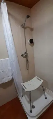 a shower in a bathroom with a sink and a toilet at La Huella del Peregrino - Ionut Preda in Palas de Rei