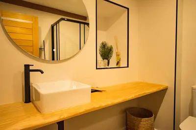 a bathroom with a sink and a mirror at hostal Nomade Santiago in Santiago de Compostela