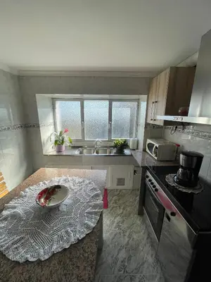 a kitchen with a table with a plate on it at A Casa da Torre Peruscallo in Belante