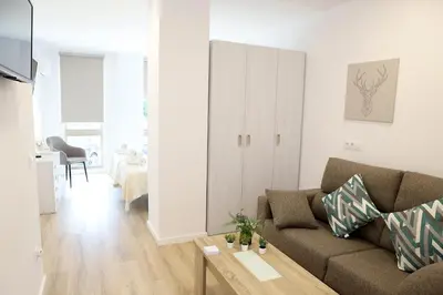 a living room with a couch and a table at Pedro Luxury in Padrón