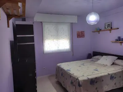 a bedroom with a bed and a window at Casa JRM 'Ribeira Sacra' in Monforte de Lemos