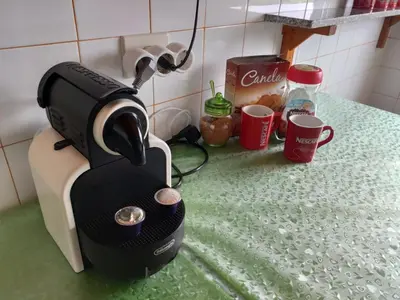 a coffee maker sitting on a counter with cups at Casa JRM 'Ribeira Sacra' in Monforte de Lemos