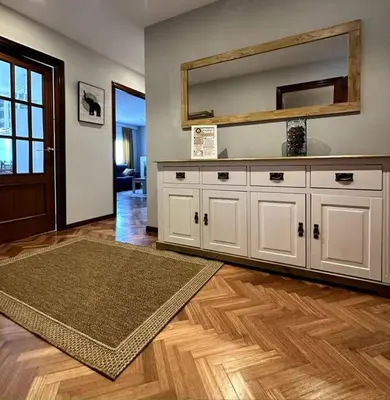 a living room with a large mirror on the wall at Apartamento Villaluz in Monforte de Lemos