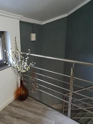 a room with a vase with flowers in it at O pallar in Bardaos