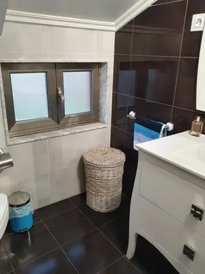 a bathroom with a sink and a toilet at O pallar in Bardaos