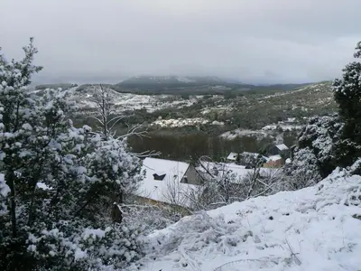 a snow covered mountain in the distance at Casa de turismo rural Sardom2 in Bembibre