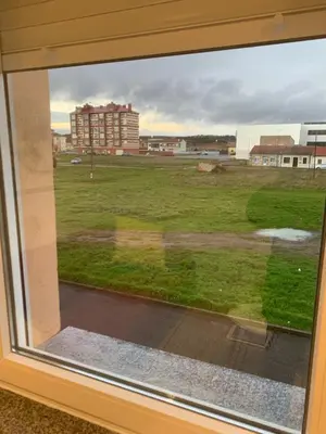 a view of a field from a window at Las candelas in Astorga