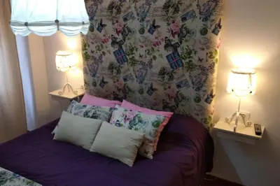 a bedroom with a bed with two lamps and two pillows at Curros Enríquez RD, Céntrico, PLAZA GARAGE in Ourense