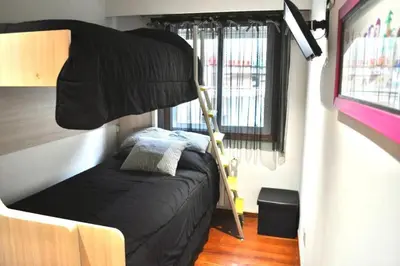a bedroom with a bunk bed in a trailer at Curros Enríquez RD, Céntrico, PLAZA GARAGE in Ourense