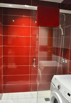 a red tiled wall in a bathroom with a washing machine at Curros Enríquez RD, Céntrico, PLAZA GARAGE in Ourense