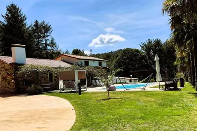 a house with a yard with a swimming pool at A chousa da folgueira in Ordes