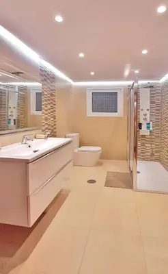 a bathroom with a sink and a toilet and a shower at Casa en Cortiñan in Bergondo