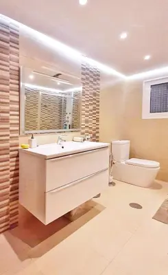 a bathroom with a large sink and a toilet at Casa en Cortiñan in Bergondo