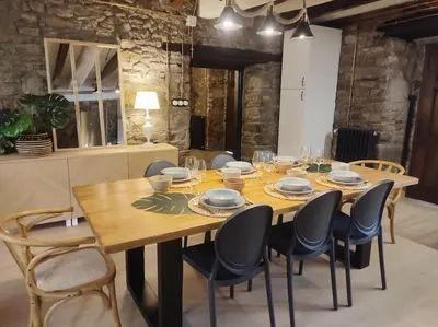 a wooden table and chairs in a room at La Escondida VuT-LE-952 in Caboalles de Abajo