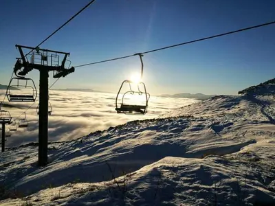 a ski lift sitting on top of a snow covered mountain at La Escondida VuT-LE-952 in Caboalles de Abajo