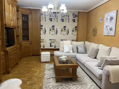 a living room with a white couch and a table at Army Deluxe in Astorga