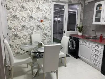 a kitchen with a table and chairs and a sink at Army Deluxe in Astorga