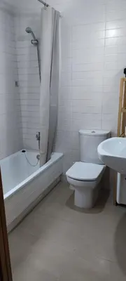 a bathroom with a toilet and a sink and a shower at BARREIROS RUA Vila in Barreiros