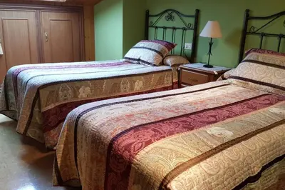 a hotel room with two beds in a room at Chalet en Miño con vistas al mar in Miño