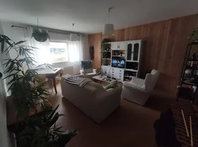 a living room with a couch and two chairs at Mira a Parque in Lugo