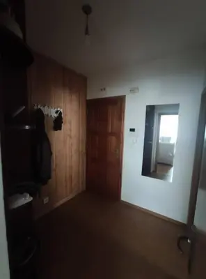 a room with wooden walls and a door and a window at Mira a Parque in Lugo